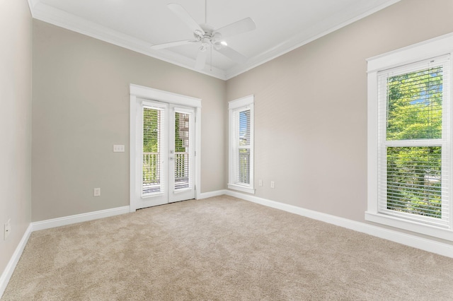 unfurnished room with light carpet, french doors, ceiling fan, and ornamental molding