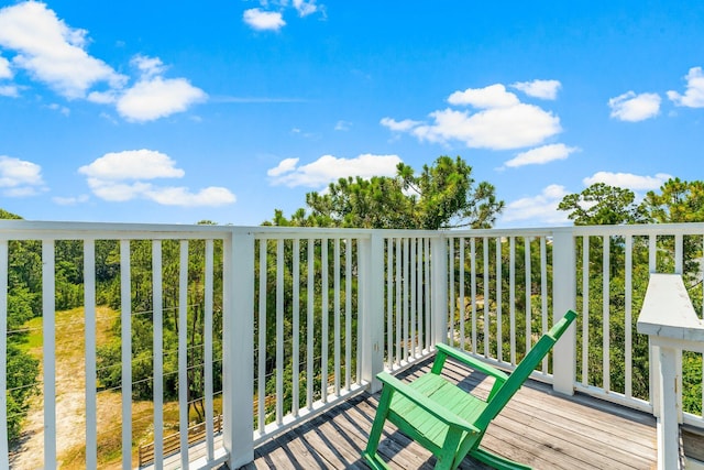 wooden balcony featuring a deck