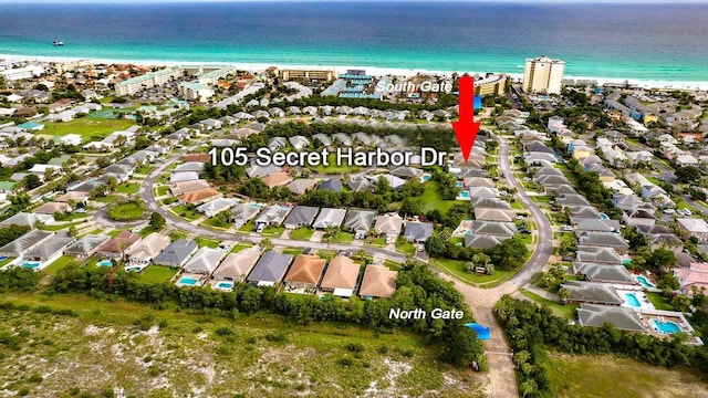 aerial view featuring a view of the beach and a water view