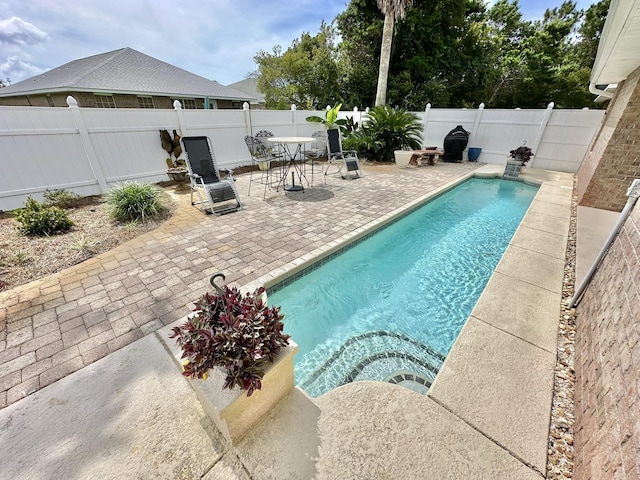 view of swimming pool featuring a patio