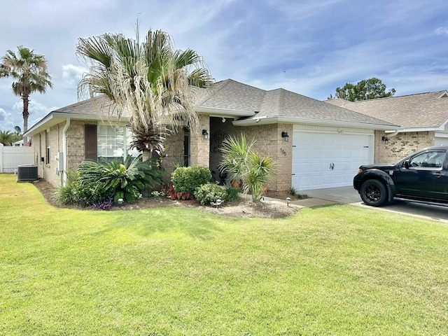 single story home with a garage, a front lawn, and central AC unit