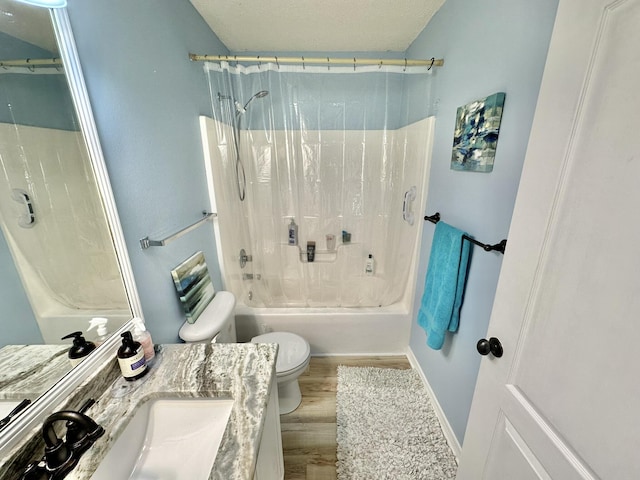 full bathroom with toilet, hardwood / wood-style flooring, shower / tub combination, and vanity