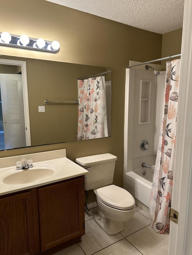 full bathroom featuring shower / bath combo, tile patterned floors, vanity, a textured ceiling, and toilet