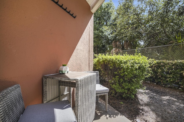 view of patio / terrace with outdoor dining space and fence