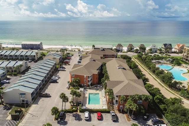 birds eye view of property with a water view and a residential view