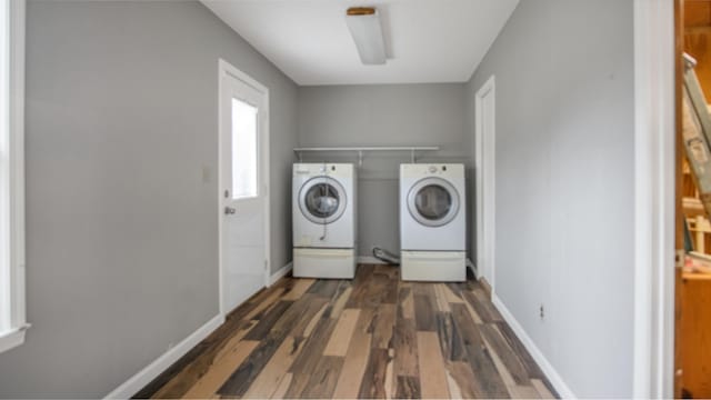 washroom featuring dark wood-type flooring and separate washer and dryer