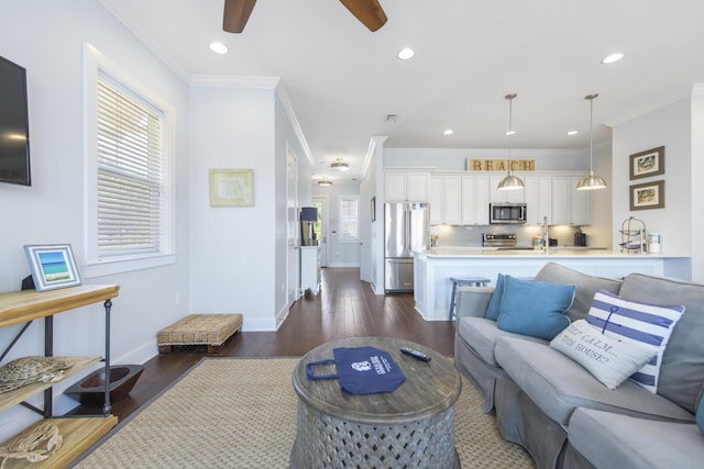 living room featuring ceiling fan, ornamental molding, and dark wood-type flooring