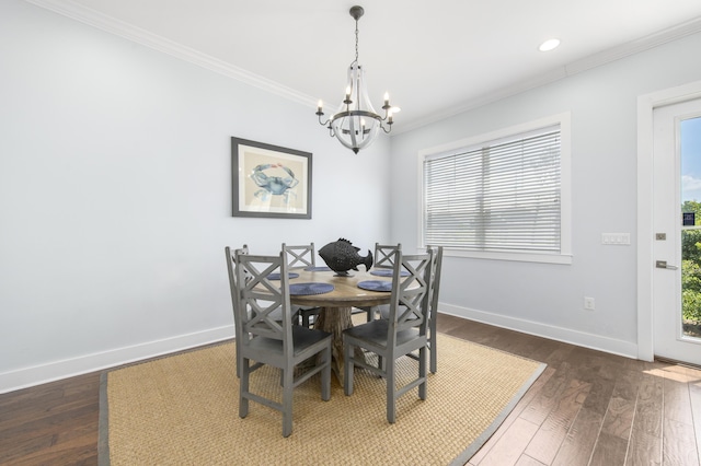 dining space featuring a wealth of natural light, a chandelier, dark hardwood / wood-style floors, and ornamental molding