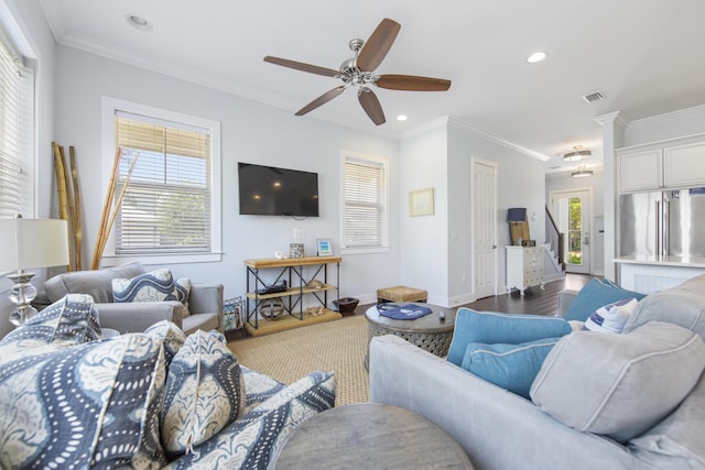 living room featuring crown molding, hardwood / wood-style floors, and ceiling fan