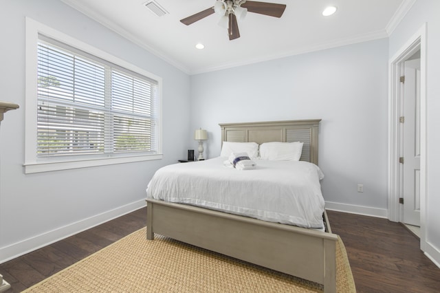 bedroom featuring ceiling fan, dark hardwood / wood-style flooring, and crown molding