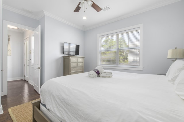 bedroom with ceiling fan, dark hardwood / wood-style flooring, and crown molding