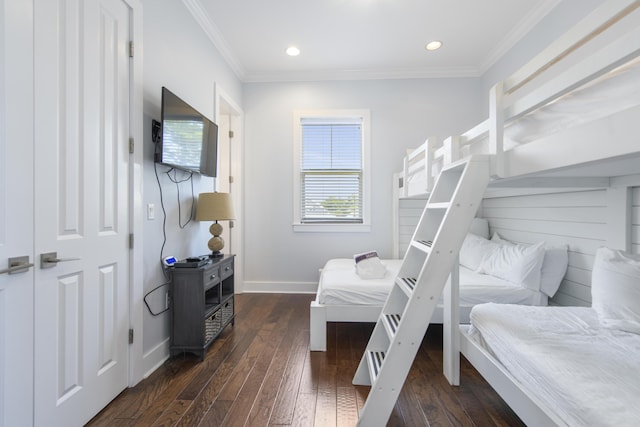 bedroom with dark hardwood / wood-style floors and crown molding