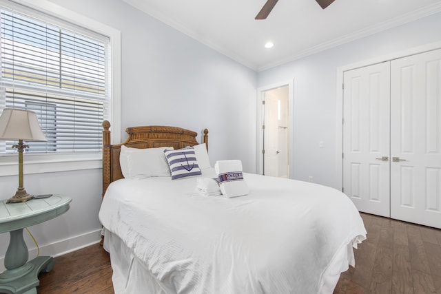 bedroom with dark hardwood / wood-style floors, a closet, ornamental molding, and ceiling fan