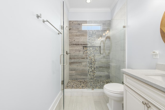 bathroom with ornamental molding, vanity, a shower with shower door, and toilet