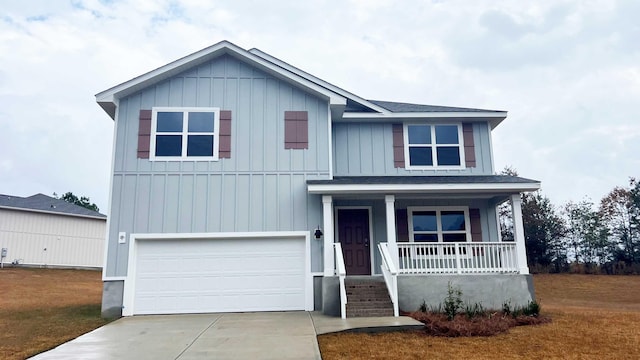 view of front of home with a porch and a garage