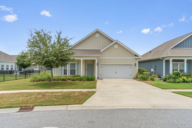 view of front of home featuring a garage and a front yard