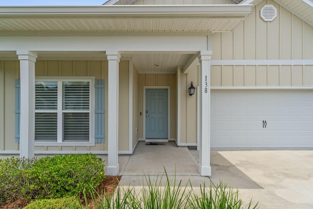 view of exterior entry with a garage