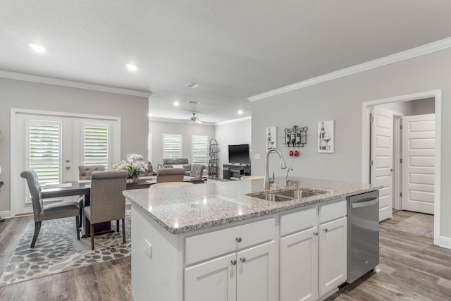 kitchen with white cabinetry, sink, dishwasher, and wood-type flooring