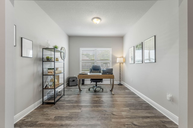 office space with a textured ceiling and dark wood-type flooring