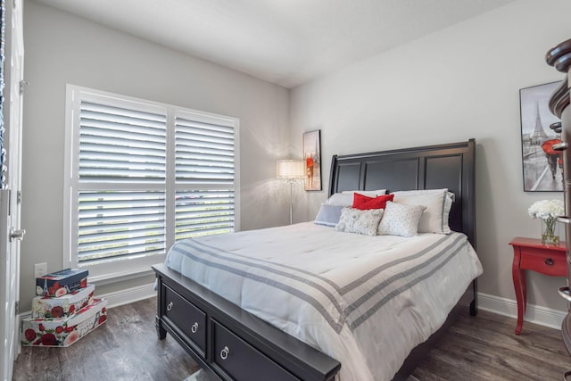 bedroom featuring dark hardwood / wood-style flooring