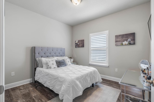 bedroom featuring dark hardwood / wood-style floors