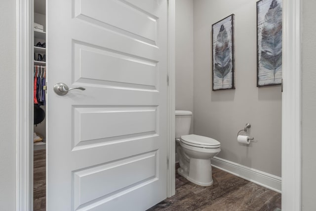 bathroom featuring hardwood / wood-style floors and toilet