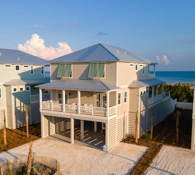 back of house with a water view