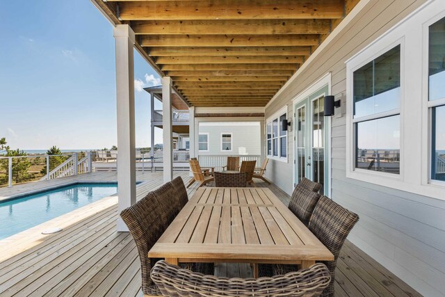 wooden terrace with outdoor lounge area