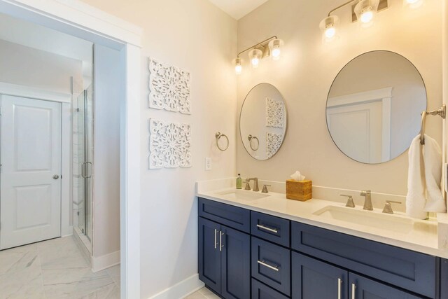 bathroom featuring a shower with door, tile flooring, and double vanity