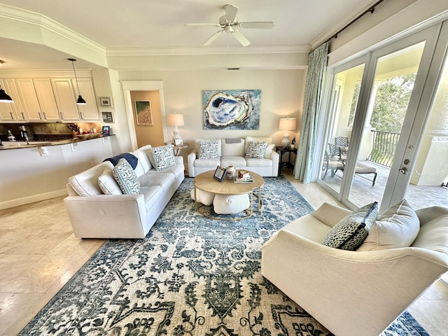 living room featuring ceiling fan, french doors, and ornamental molding