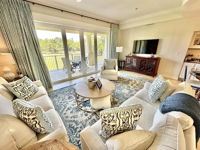 living room featuring crown molding, french doors, and plenty of natural light