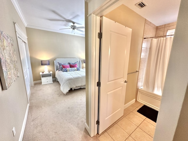 bedroom with ceiling fan, ornamental molding, and light tile patterned flooring