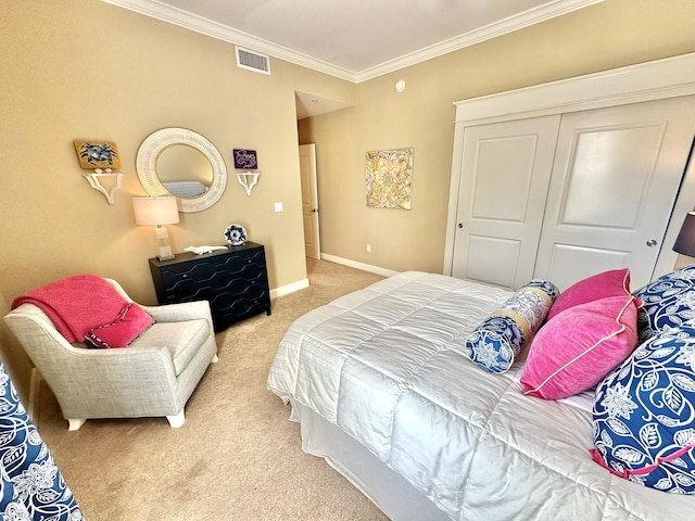 carpeted bedroom with a closet and ornamental molding