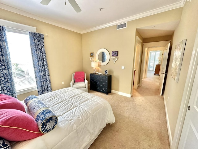 bedroom with ceiling fan, light colored carpet, and ornamental molding