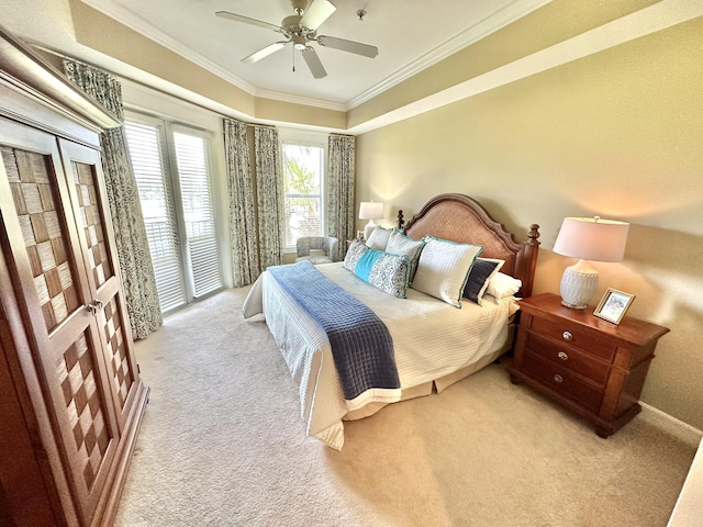 carpeted bedroom with ceiling fan and ornamental molding