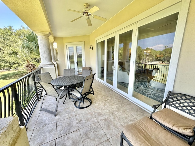 balcony with ceiling fan and french doors