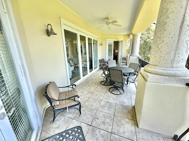 view of patio / terrace featuring ceiling fan and french doors