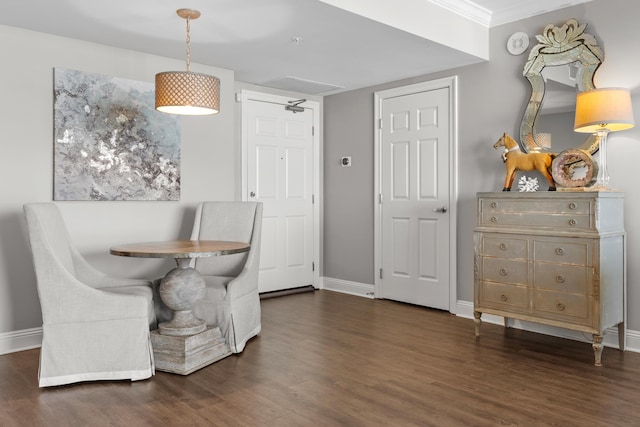 dining room with crown molding and dark hardwood / wood-style flooring