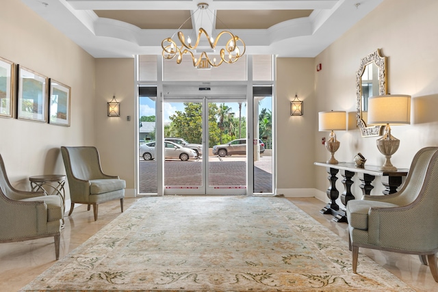 living area featuring a tray ceiling, an inviting chandelier, light tile patterned floors, and ornamental molding