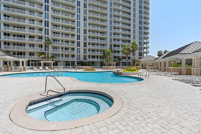 view of swimming pool featuring a patio area