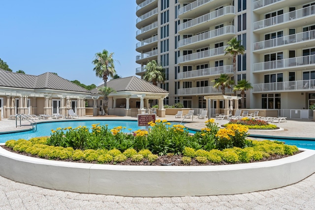 view of swimming pool with a patio