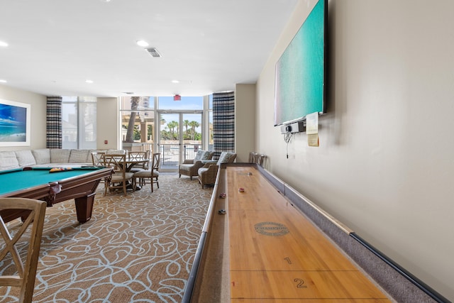 recreation room featuring billiards, carpet floors, and a wall of windows