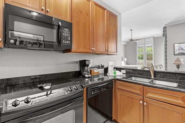 kitchen with black appliances, ceiling fan, sink, and dark stone counters