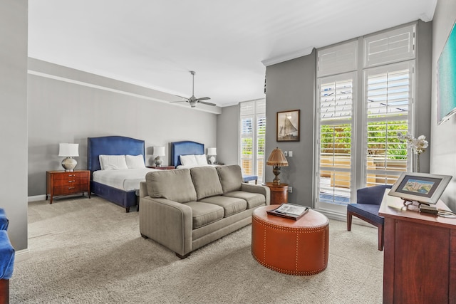 bedroom with light carpet, ceiling fan, and crown molding