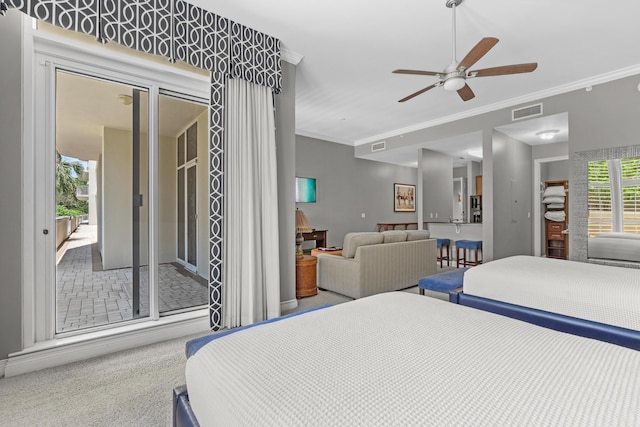 carpeted bedroom featuring access to exterior, ceiling fan, and ornamental molding