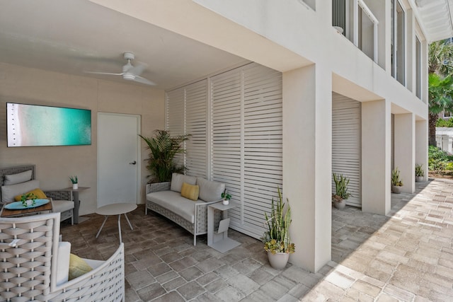 view of patio featuring outdoor lounge area and ceiling fan