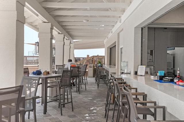 view of patio featuring an outdoor bar