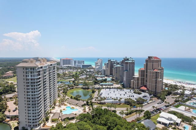 drone / aerial view featuring a water view and a view of the beach