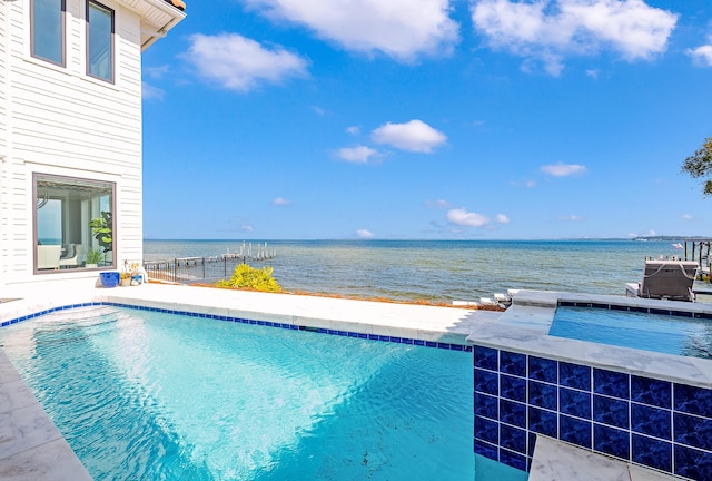 view of pool with a water view