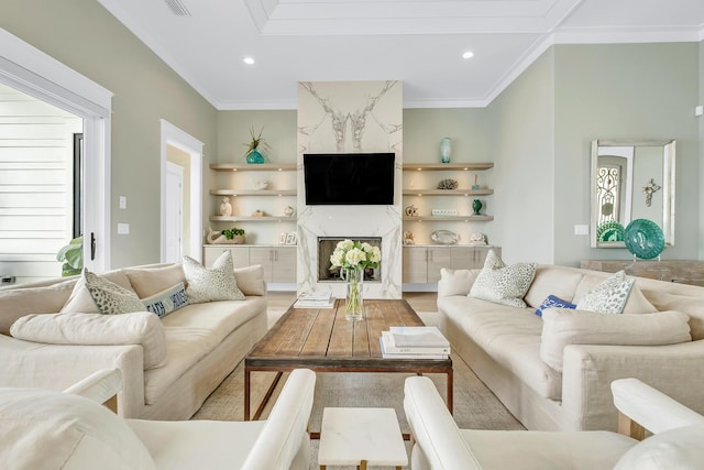 living room featuring a fireplace, hardwood / wood-style floors, and ornamental molding